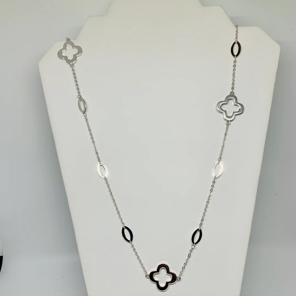 Elegant Silver Necklace with Clover Accents